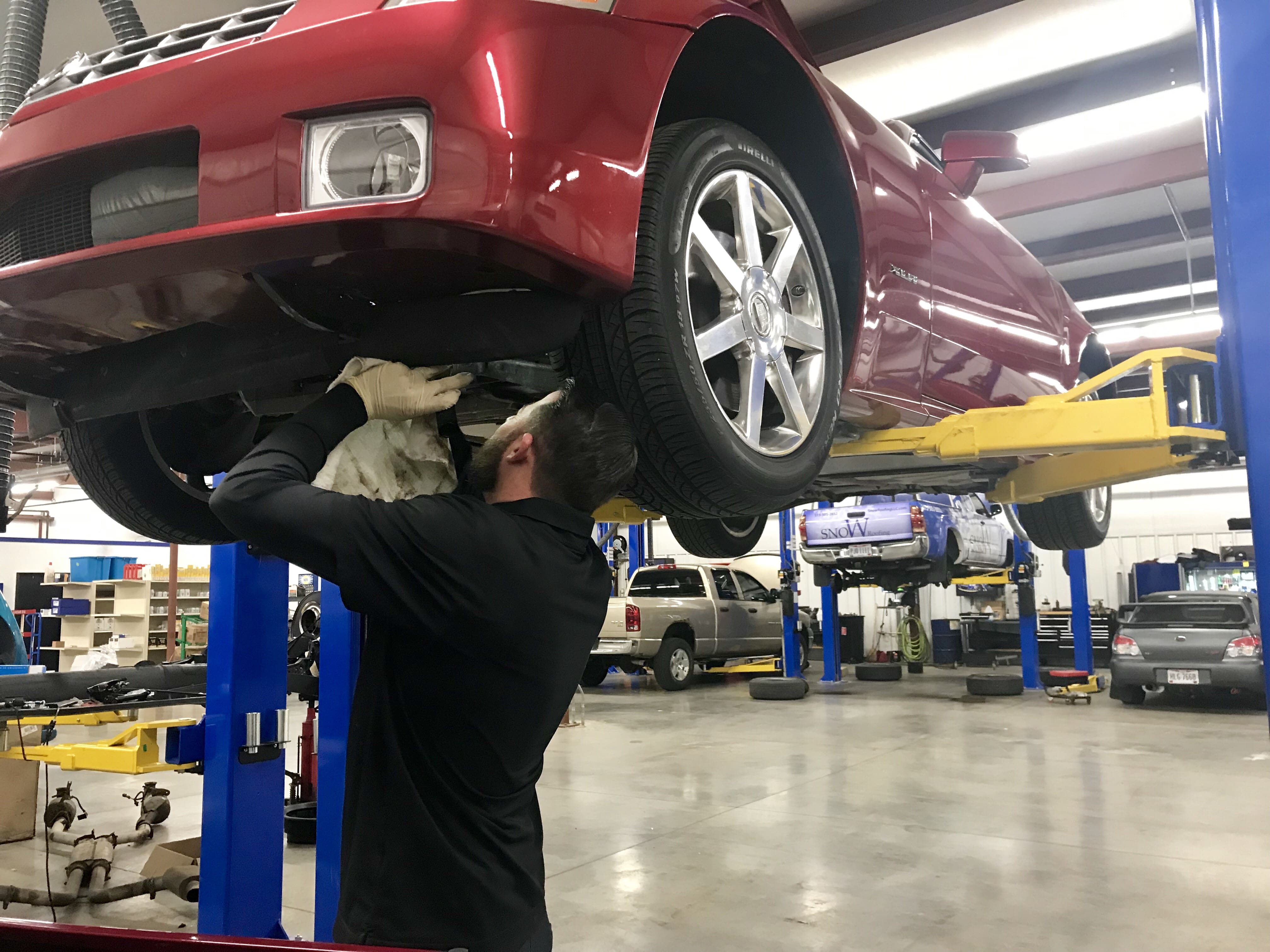 mechanic servicing car at Schmidt Auto Care, springboro, oh